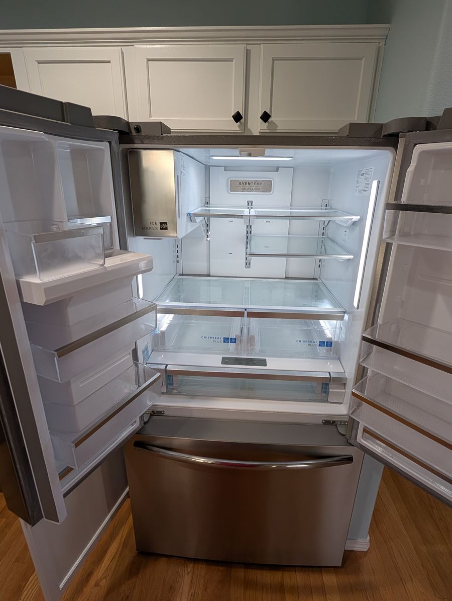 Refrigerator with doors open, clean after cleaning